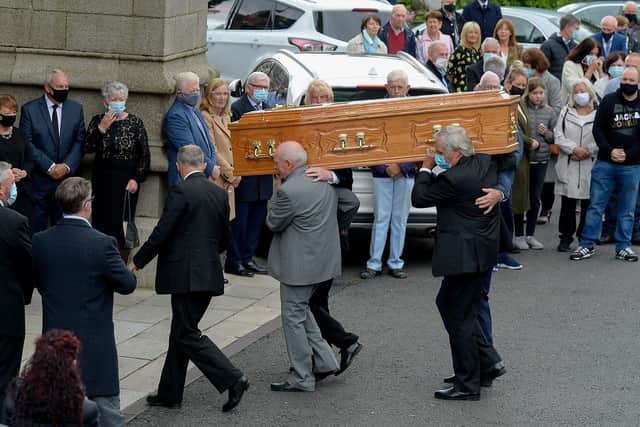 The coffin of Fr. Neal Carlin is carried into St Eugene’s Cathedral, on Monday morning for Requiem Mass. Photo: George Sweeney / Derry Journal.  DER2121GS – 020