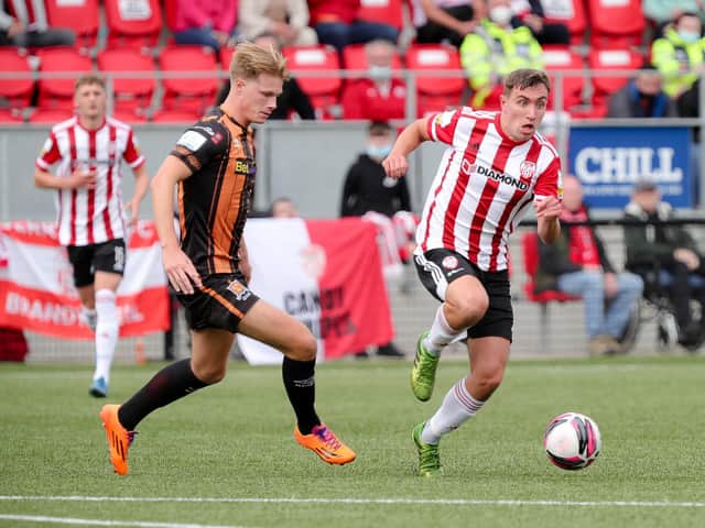 Derry City's Joe Thomson skips away from Dundalk defender Daniel Cleary. Picture by Kevin Moore/MCI