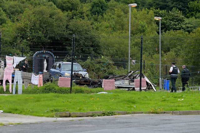 Police officers attend the  site on Ballyarnett Road this afternoon after a mobile home was destroyed by fire. DER2133GS – 023