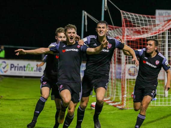 Derry City's Ronan Boyce races away with team-mates Will Fitzgerald, Eoin Toal and Joe Thomson celebrating his late winner. Picture by Kevin Moore/MCI
