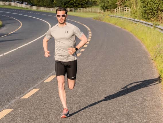 Derry GP Gavin McAteer out on a training run ahead of his remarkable charity bid to run the length of Ireland in six days.