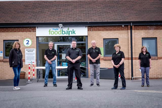 James McMenamin with some of the volunteers at Foyle Foodbank. (Stephen Latimer)