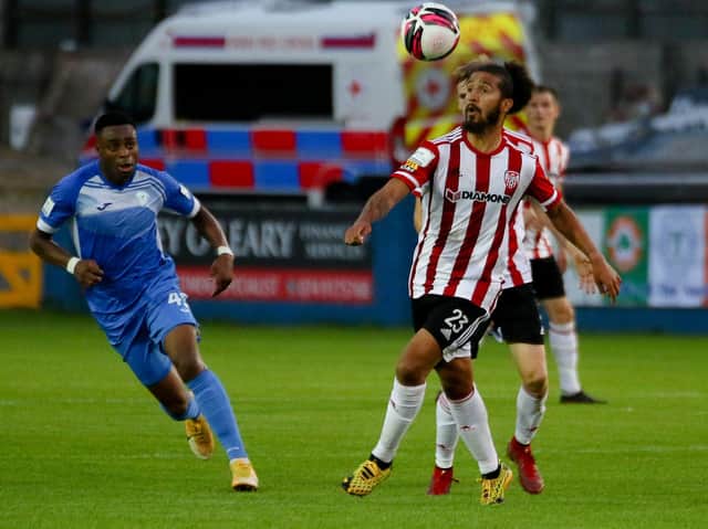 Derry City's Bastien Hery keeps his eye on the ball as Finn Harps striker Tunde Owolabi closes in. Picture Kevin Moore/mci