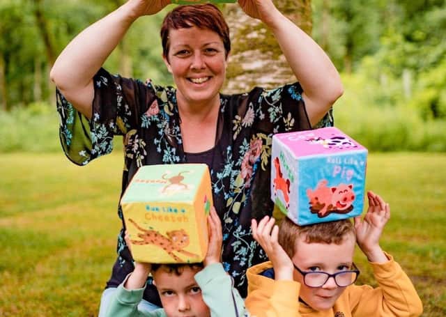 Caitrin Kincaid with her sons Cooper and Carter and the toy Cubefun