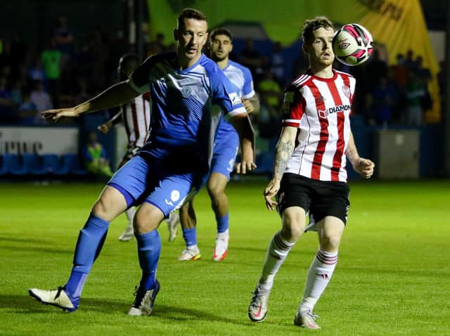 Derry City's Jamie McGonigle shields the ball from Finn Harps' Shane McEleney. Picture Kevin Moore/mci