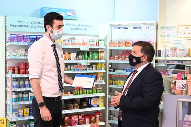 Pictured launching the Pharmacy Collect service for rapid COVID-19 tests are Boots Pharmacist Ryan McCullough and Vice-Chair of Community Pharmacy NI, Peter Rice. Picture: Michael Cooper