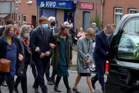 The children of Pat Hume walk behind the  funeral cortege as it leaves St Eugene’s Cathedral after Requiem Mass on Monday morning.  Photo: George Sweeney.  DER2136GS – 053