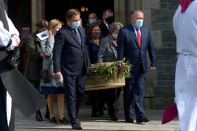 The coffin of Pat Hume is carried by her children from St Eugene’s Cathedral after Requiem Mass on Monday morning.  Photo: George Sweeney.  DER2136GS – 049