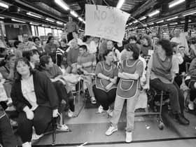 The scene when workers at the crisis torn Coats Viyella factory at Maydown ceased production during a management meeting.