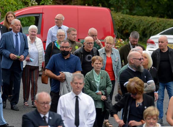Mourners at Fionnbarra ODochartaighs funeral included veteran civil rights campaigner, Eamonn McCann.