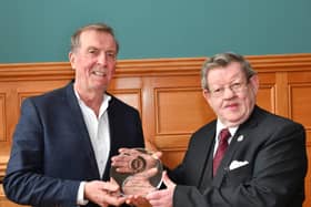 2019... Aidan McKinney presents Fionnbarra O'Dochartaigh with a lifetime achievement award in recognition of his contribution to civil rights issues.