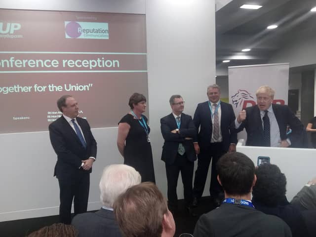 Jeffrey Donaldson, with party colleagues, listening to Boris Johnson at a DUP drinks reception at the Conservative Party conference in October 2019.
