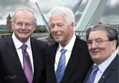 Joe Campbell’s digital painting of Martin McGuinness, Bill Clinton and John Hume on Derry’s Peace Bridge.