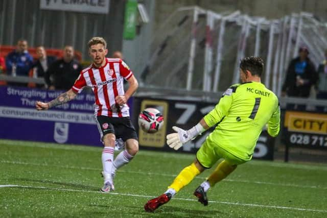 Mark Anthony McGinley produces a stunning save to deny Jamie McGonigle late on. Photograph by Kevin Moore.