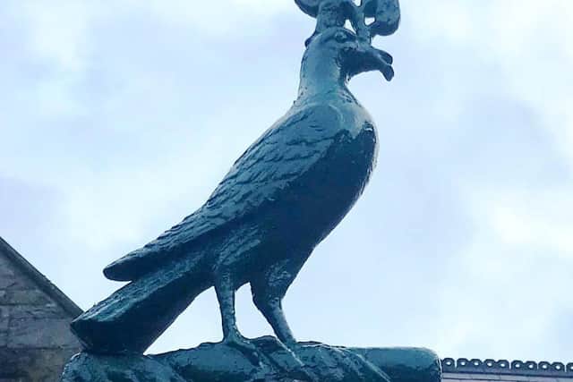 A close-up of the ornamental dove that remains in situ.