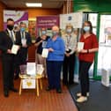 Members of Compassionate Communities pictured in the Central Library Foyle Street, on Thursday morning last, donating books on death, dying, grief and bereavement to help educate and improve public understanding of death and dying. From left are Sharon Williams, Mayor Alderman Graham Warke, Donal Henderson, Kathleen Bradley, Margaret Rowlandson, Carol Devine, manager Central Library and Caroline Anderson.Photo: George Sweeney.  DER2137GS – 024