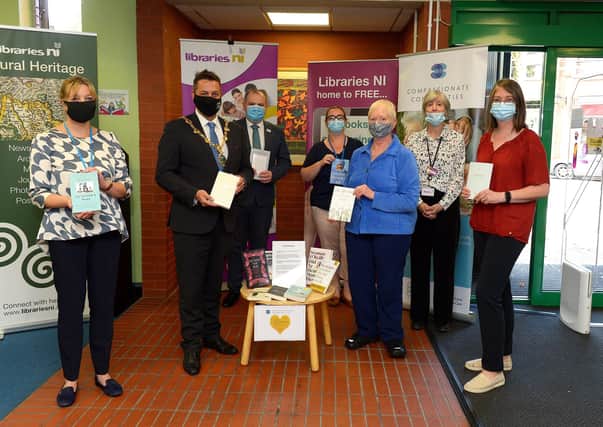 Members of Compassionate Communities pictured in the Central Library Foyle Street, on Thursday morning last, donating books on death, dying, grief and bereavement to help educate and improve public understanding of death and dying. From left are Sharon Williams, Mayor Alderman Graham Warke, Donal Henderson, Kathleen Bradley, Margaret Rowlandson, Carol Devine, manager Central Library and Caroline Anderson.Photo: George Sweeney.  DER2137GS – 024