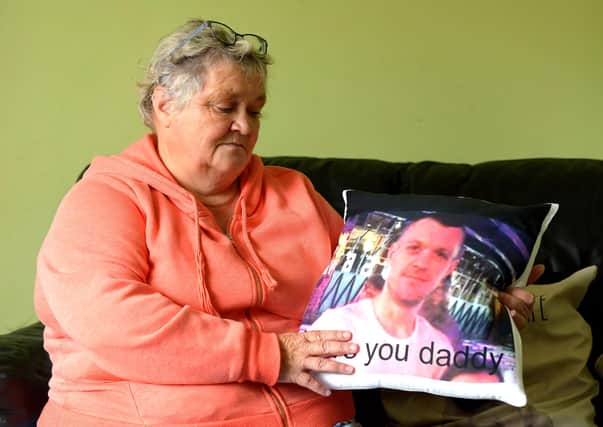 Ruth Bone with a memento of her late son Dale who died of a suspected overdose in May.