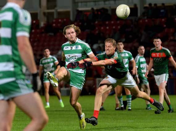 Faughanvale’s Michael Sweeney scores a first half point against Slaughtmanus at Celtic Park on Friday evening. Photo: George Sweeney