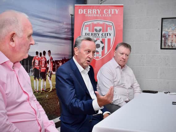 New Derry City honorary president Paul Diamond pictured alongside CEO Sean Barrett and chairman Philip O'Doherty. Photograph by Kevin Morrison.
