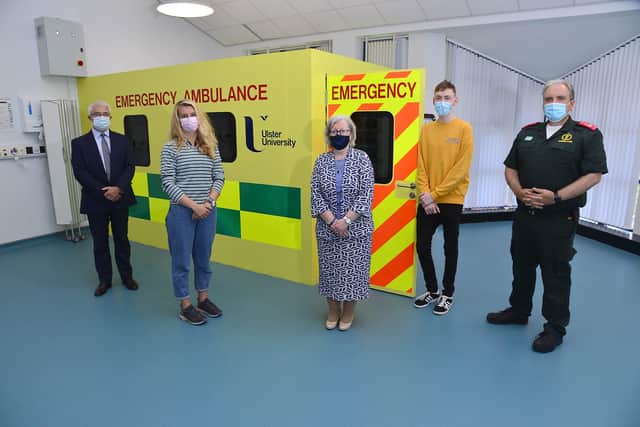 Staff, students and NIAS representatives in the first of its kind simulated ambulance to be used in teaching the new programme. From left are  Michael Bloomfield, Chief Executive of NIAS, student Megan, Professor Carol Curran, Executive Dean of the School of Life and Health Sciences, student Conor and Dr Nigel Ruddell, Medical Director, NIAS.