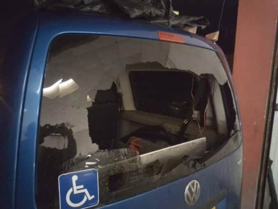 The damage sustained in the attack on the taxi last night.