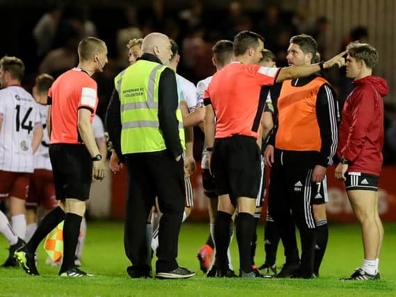 Derry City boss Ruaidhri Higgins challenges referee Rob Harvey’s decision to add three extra minutes of injury time after the 3-3 draw with Bohs at Dalymount. Photographs by Kevin Moore.