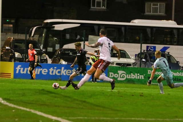 Jamie McGonigle puts in a cross during Monday night's clash at Dalymount Park. Photograph by Kevin Moore.