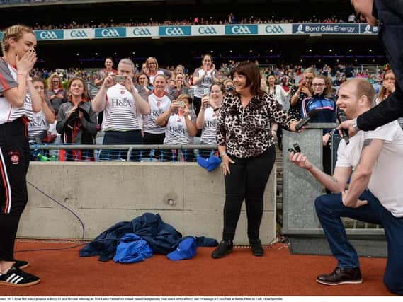 Ryan McCloskey proposes to Derry's Ciara McGurk following the TG4 Ladies Football All-Ireland Junior Championship Final match between Derry and Fermanagh at Croke Park in  September 2017. (Photo by Cody Glenn/Sportsfile)