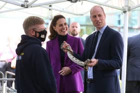 The Duke and Duchess of Cambridge get up close and personal with a snake during their visit to UU Magee in Derry.