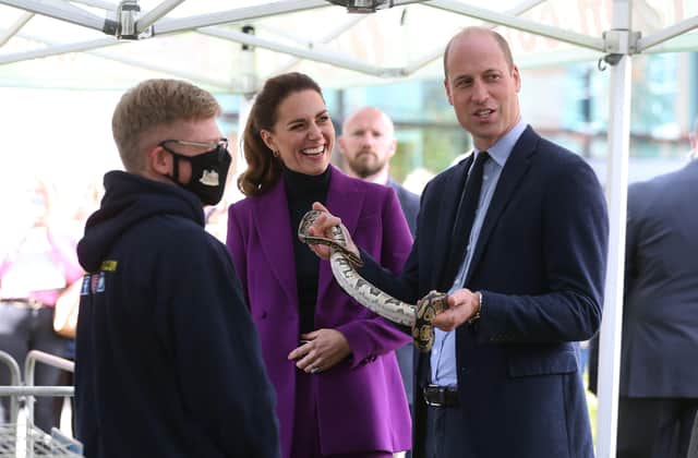 The Duke and Duchess of Cambridge get up close and personal with a snake during their visit to UU Magee in Derry.