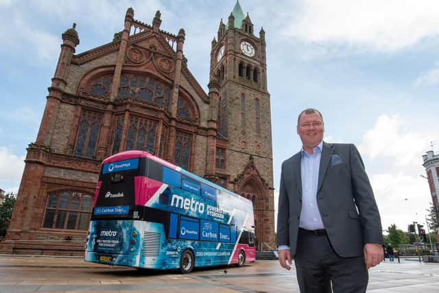 Stephen Gillespie, Director of Business and Culture at Derry City and Strabane District Council, with the Hydrogen bus when it visited the Guildhall.