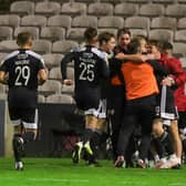 Ruaidhri Higgins celebrates with his players after James Akintunde scores at Dalymount Park in Derry City's last league outing.