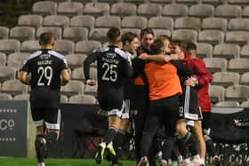 Ruaidhri Higgins celebrates with his players after James Akintunde scores at Dalymount Park in Derry City's last league outing.