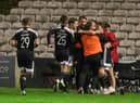 Ruaidhri Higgins celebrates with his players after James Akintunde scores at Dalymount Park in Derry City's last league outing.