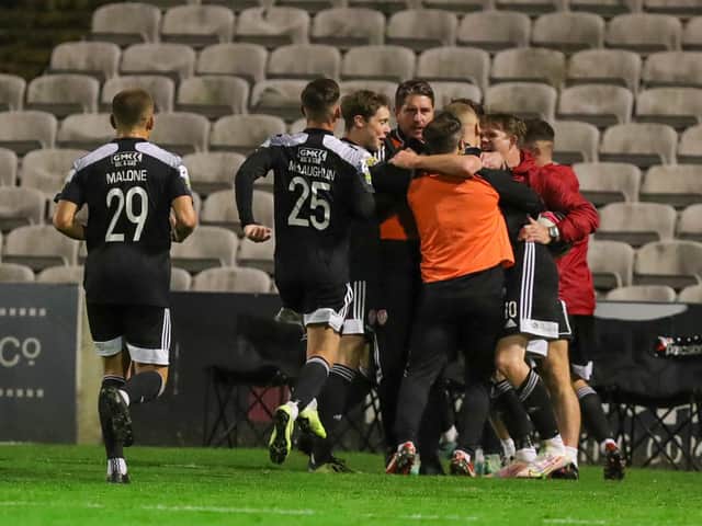 Ruaidhri Higgins celebrates with his players after James Akintunde scores at Dalymount Park in Derry City's last league outing.