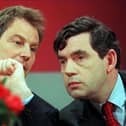 Tony Blair, opposition Labour party leader, and Gordon Brown, shadow chancellor, confer at a 1997 election campaign press conference