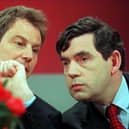 Tony Blair, opposition Labour party leader, and Gordon Brown, shadow chancellor, confer at a 1997 election campaign press conference