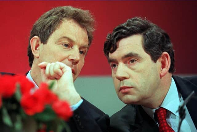 Tony Blair, opposition Labour party leader, and Gordon Brown, shadow chancellor, confer at a 1997 election campaign press conference