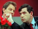 Tony Blair, opposition Labour party leader, and Gordon Brown, shadow chancellor, confer at a 1997 election campaign press conference