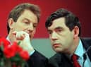Tony Blair, opposition Labour party leader, and Gordon Brown, shadow chancellor, confer at a 1997 election campaign press conference