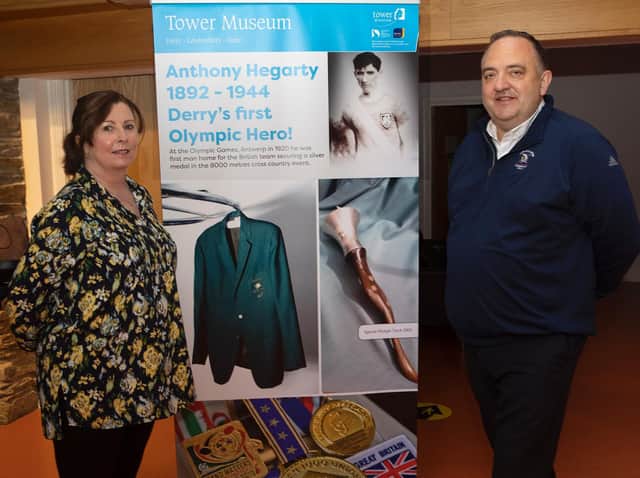 Betty Doherty, Education and Access Officer, Tower Museum, pictured with Paul Hegarty whose great uncle Anthony Hegarty (silver medal 8000 metres cross country, Olympic Games,1920), was Derry's first Olympic hero, at the launch of a temporary exhibition entitled 'Sports of Our Time' at the Tower Museum.
