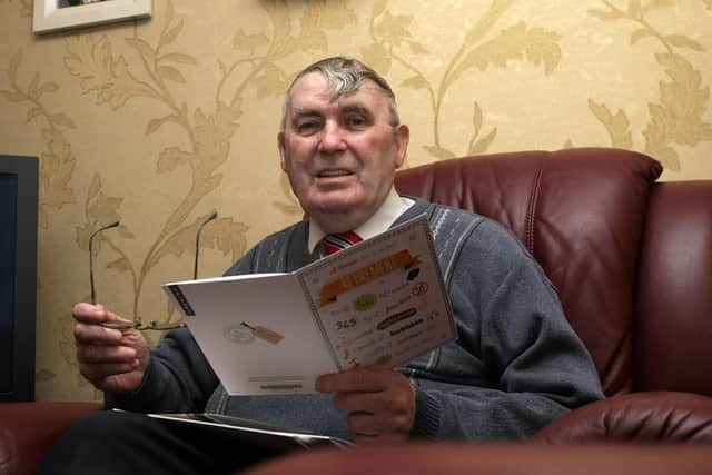 2015: Derry City Councillor Jim Clifford reading some wellwisher cards at his Creggan home as he retired. DER1315MC057