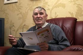 2015:  Derry City Councillor Jim Clifford reading some wellwisher cards at his Creggan home as he retired. DER1315MC057