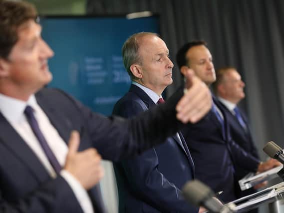 Taoiseach Micheál Martin (second from left), with, from left to right, the Minister for the Environment, Climate Communications and Transport, Eamon Ryan TD, Tánaiste Leo Varadkar TD and the Minister for Public Expenditure and Reform, Michael McGrath.