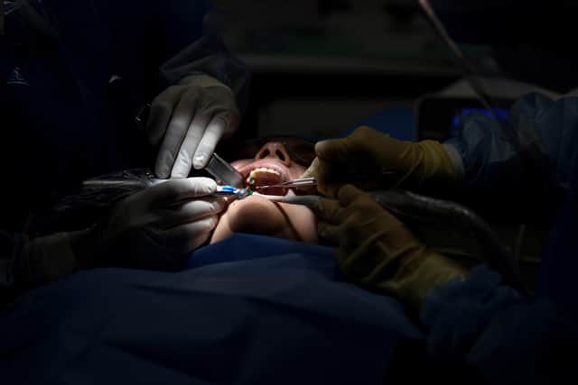 Dentists. File picture. (Photo by OSCAR DEL POZO / AFP) (Photo by OSCAR DEL POZO/AFP via Getty Images)