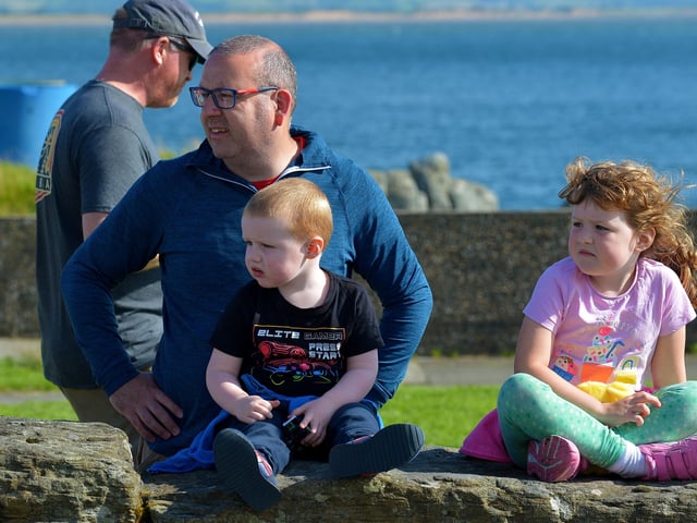Spectators at the children’s Pedal Powered Tractor Run and Doll Push, at the Greencastle Regatta, on Friday afternoon last. Photo: George Sweeney. DER2231GS – 080