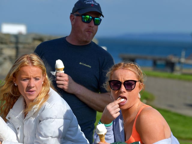 Spectators at the children’s Pedal Powered Tractor Run and Doll Push, at the Greencastle Regatta, on Friday afternoon last. Photo: George Sweeney. DER2231GS – 081