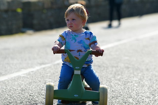 Keeping an eye on the competition during the Pedal Powered Tractor Run and Doll Push race at the Greencastle Regatta on Friday afternoon last. Photo: George Sweeney.  DER2231GS – 079