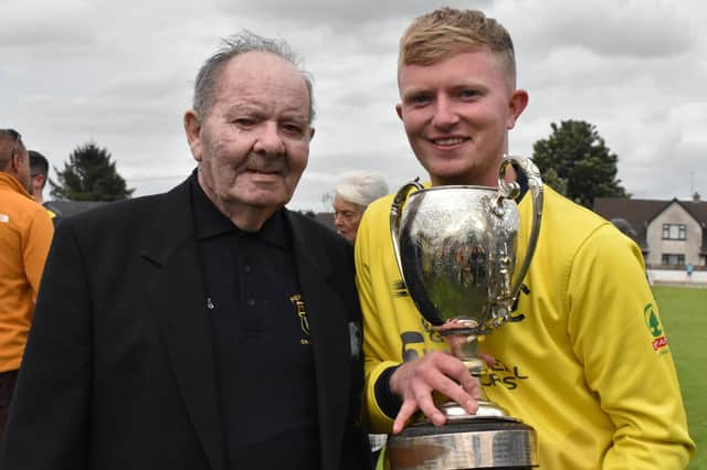 Proud Fox Lodge captain, Aaron Heywood, proudly shows off the Sports Hub North West Senior Cup to his grandfather and club stalwart, Jackie Heywood following Saturday's dramatic victory over Newbuildings in Eglinton. (Photo: Lawrence Moore)